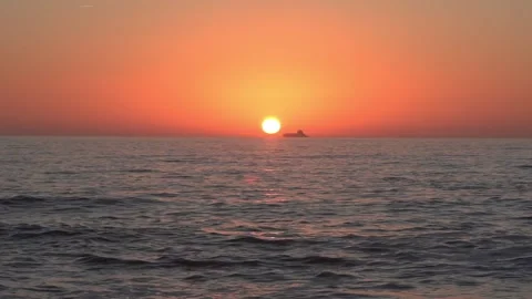 Sunset over the Sea with a Large Ship Approaching the Sun - 1827 Stock Footage 314891894