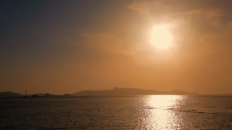 Sunset over the sea. Mountains in the background. Stock Footage 247555459