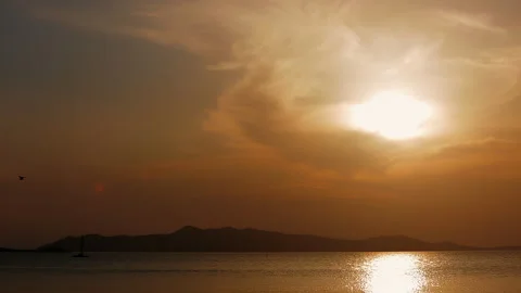 Sunset over the sea. Mountains in the background. Video stock 252748338