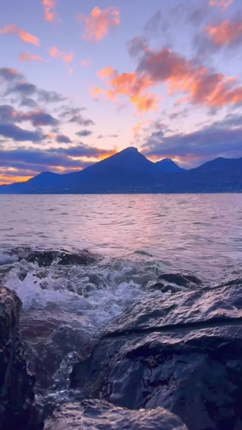 Sunset over the sea with mountains Stock Footage 273868708