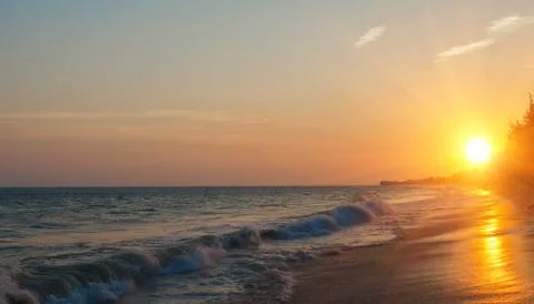 Sunset over the sea Stock Photos