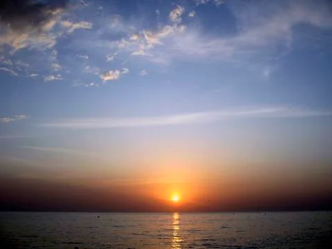 Sunset over the sea Stock Photos
