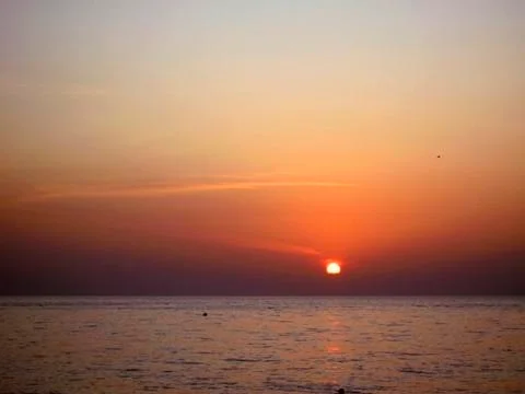 Sunset over the sea Stock Photos