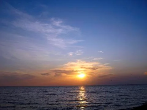Sunset over the sea Stock Photos