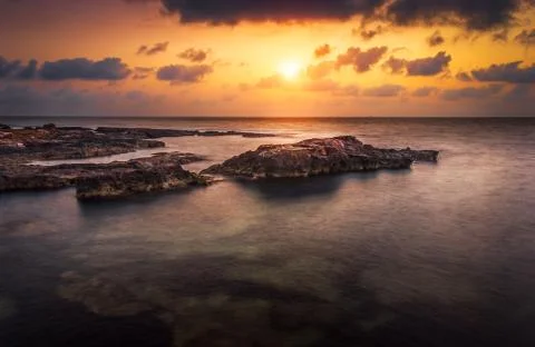 Sunset over the sea Stock Photos