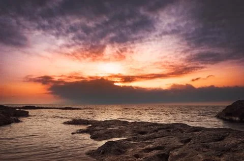 Sunset over the sea Stock Photos