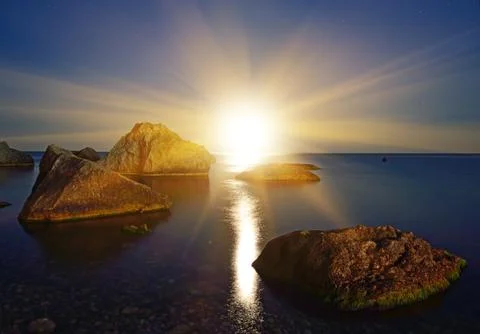 Sunset over the sea Stock Photos