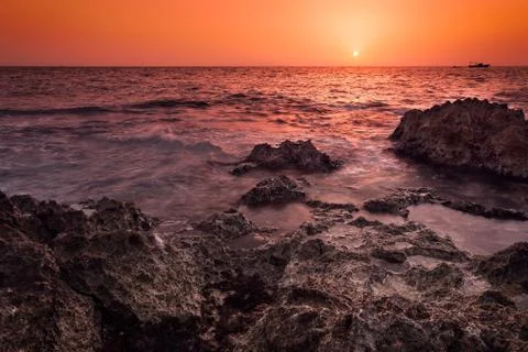 Sunset over the sea Stock Photos