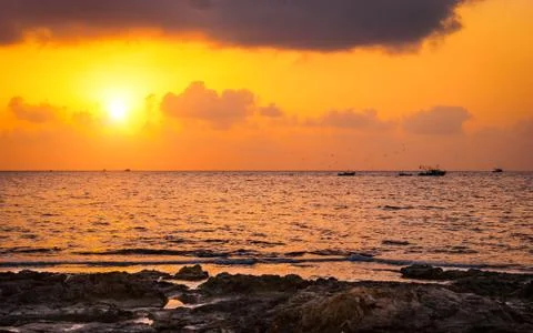 Sunset over the sea Stock Photos