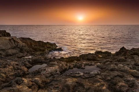 Sunset over the sea Stock Photos