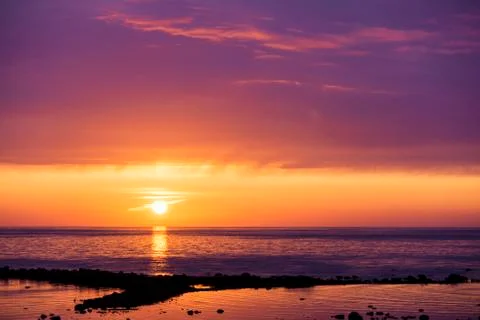 Sunset over the sea Stock Photos