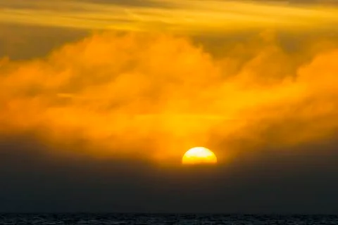 Sunset over the sea Stock Photos