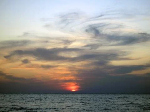 Sunset over the sea Stock Photos