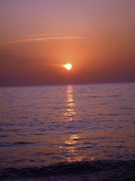 Sunset over the sea Stock Photos