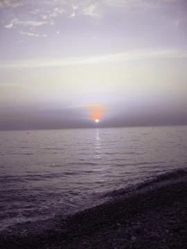 Sunset over the sea Stock Photos