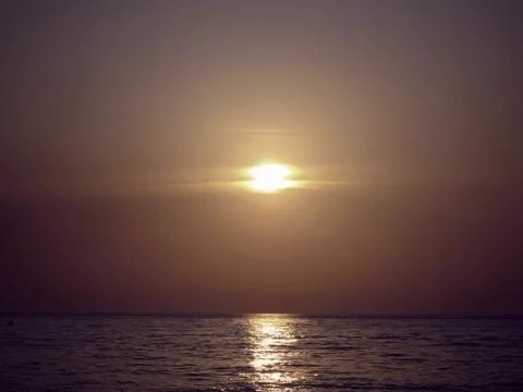 Sunset over the sea Stock Photos