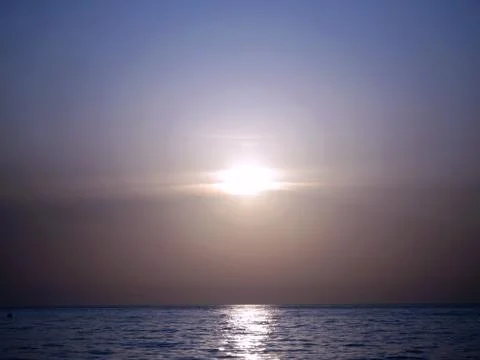Sunset over the sea Stock Photos