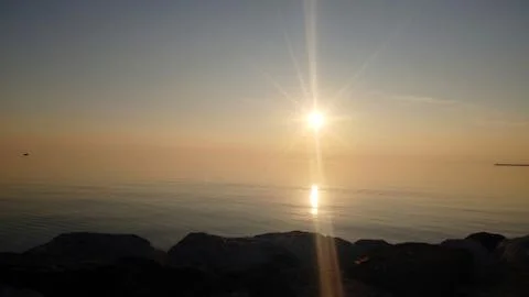 Sunset over the sea Stock Photos