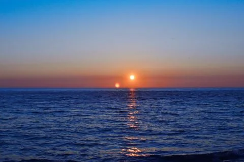 Sunset over the sea Stock Photos