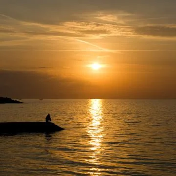 Sunset over the sea Stock Photos