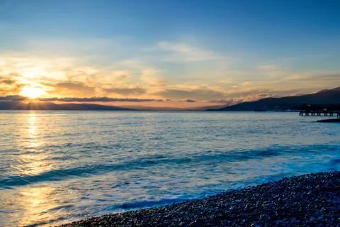 Sunset over sea Stock Photos