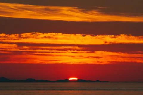 Sunset over sea Stock Photos