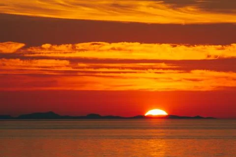 Sunset over sea Stock Photos