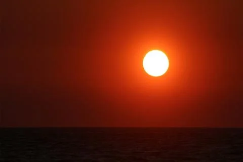Sunset over the sea Stock Photos