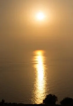 Sunset over the sea Stock Photos