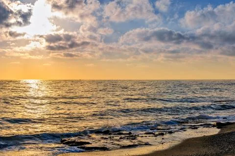 Sunset over the sea Stock Photos