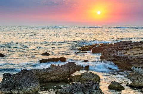Sunset over the sea Stock Photos