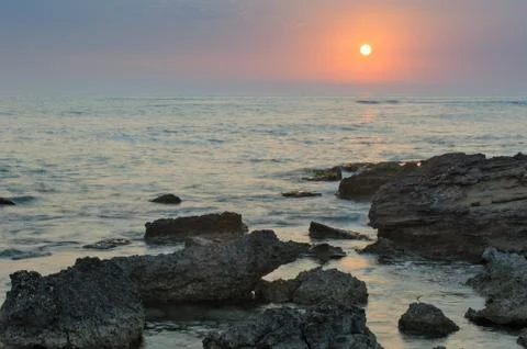 Sunset over the sea Stock Photos