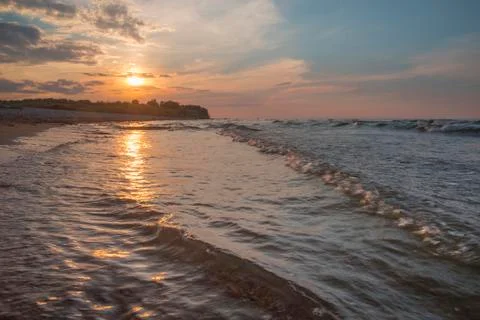 Sunset over the sea Stock Photos