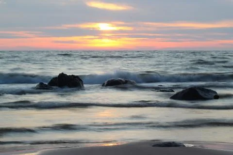 Sunset over sea Stock Photos