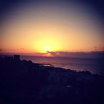 Sunset over the sea Stock Photos