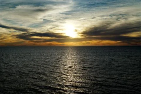 Sunset over the sea Stock Photos