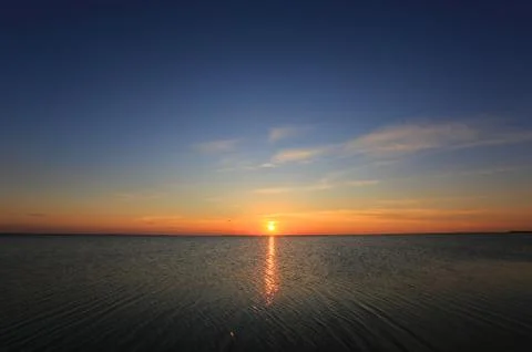 Sunset over sea Stock Photos