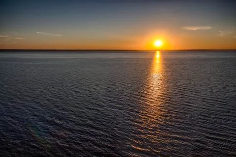 Sunset over the sea Stock Photos