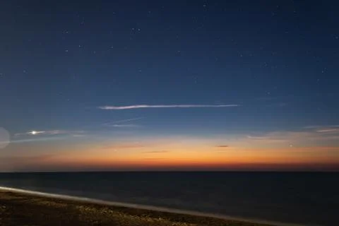 Sunset over the sea Stock Photos