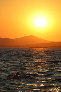 Sunset over sea Stock Photos