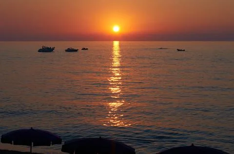 Sunset over the sea Stock Photos