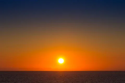 Sunset over the sea Stock Photos