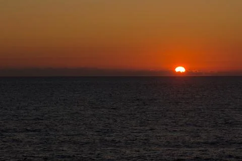 Sunset over the sea Stock Photos