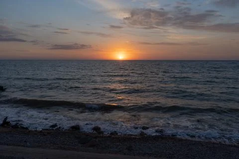 Sunset over the sea Stock Photos