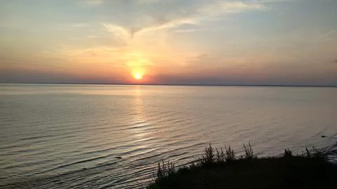 Sunset over the sea Stock Photos