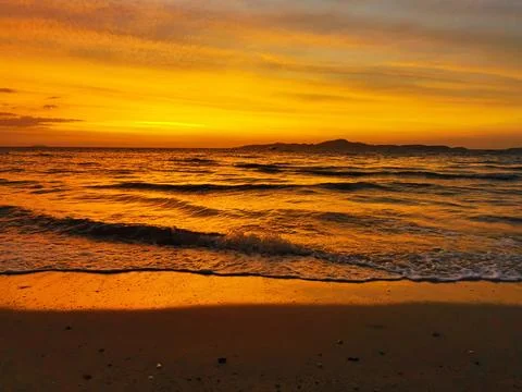 Sunset over sea Stock Photos