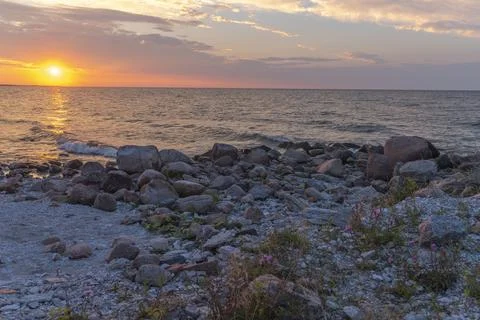 Sunset over the sea Stock Photos