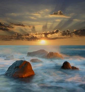 Sunset over sea Stock Photos