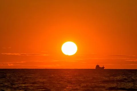 Sunset over the sea Stock Photos