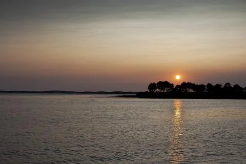Sunset over the sea Stock Photos